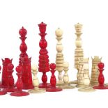 A 19th century red and white stained ivory chess set, King height 10cm, all pieces complete but with