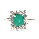 An 18ct gold emerald and diamond cluster ring, total diamond content approx 0.45ct, setting height