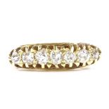 A 14ct gold 7-stone graduated diamond half-hoop ring, setting height 5.3mm, size L, 2.9g