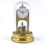 A Tiffany Never Wind battery driven brass clock under glass dome, height 25cm