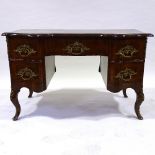 An 18th century Italian (possibly Maltese) walnut desk, shaped moulded and banded top, with shaped