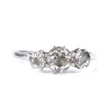 An unmarked white metal 3-stone diamond ring, total diamond content approx 1ct, setting height 6.