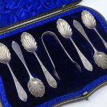 A cased set of Edwardian silver spoons and sugar tongs, with shell bowls, by Wakely & Wheeler,