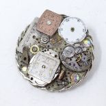 A modern circular brooch made from various watch parts, signed, brooch diameter 40.2mm, 17g