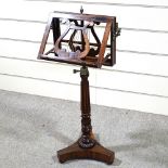 A William IV rosewood duet music stand with brass candle brackets, reeded tulip carved and turned