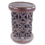 A Cameroon Tribal carved and pierced wood spider design stool, height 37cm, diameter 26cm