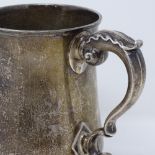 A George III silver pint mug, of plain form with acanthus leaf handle, possibly by John Kidder,