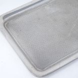A George V rectangular silver tray, with engine turned decoration, indistinct maker's marks,