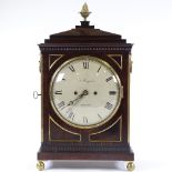 A 19th century mahogany-cased bracket clock with brass mouldings and mounts, painted dial signed J