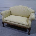 An upholstered scroll-end sofa on carved mahogany base, length approx 5'