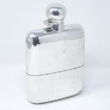 A large curved silver spirit flask, with screw cap and removable cup with gilt interior, by James