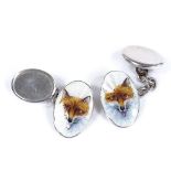 A pair of Continental silver and enamel hunting fox head oval cufflinks, panel length 18.8mm, 6.5g