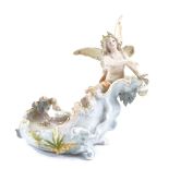 A German porcelain table centre bowl, surmounted by a winged nymph, blue glaze cross forks marks,