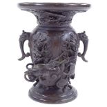 A Japanese patinated bronze vase with cast dragon entwined body, signed under base, height 13.5cm