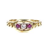 An 18ct gold 3-stone ruby and diamond ring, with flat curb link design shoulders, setting height 7.