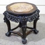 A Chinese 19th century carved hardwood low table, with inset marble top and carved and pierced