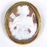 A Victorian relief carved cameo shell panel brooch, depicting Goddess Diana, in unmarked yellow
