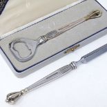 A cased golden crown silver-handled bottle opener, length 14cm, and matching paper knife, by W S