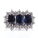 A 9ct gold sapphire and white stone triple-cluster ring, setting height 11mm, size J, 2.5g