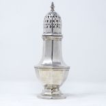 An octagonal silver sugar shaker, by Sanders & Mackenzie, hallmarks Birmingham 1971, height 17cm,