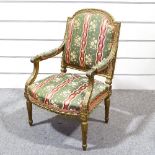 A 19th century French carved giltwood framed open armchair