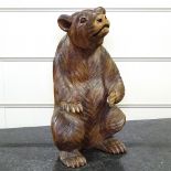 A carved hardwood Black Forest style standing bear, height 17"