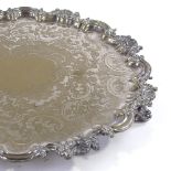 A large Victorian electroplate tray with cast shaped rim, diameter 51cm