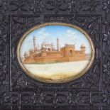 A 19th century Indian miniature watercolour on ivory depicting temple buildings, in original