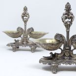 A pair of 19th century cast French silver Rococo style table salts, with gilt shell design bowls and