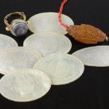 A group of Chinese mother-of-pearl gaming counters, an agate set gilt-metal ring, and a carved nut