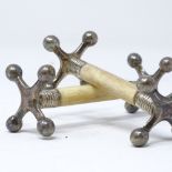 A pair of silver-mounted ivory knife rests by John Biggin, hallmarks Sheffield 1925, length 8cm
