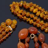 2 polished bead amber necklaces, largest length 18cm, 40.4g total, together with a carnelian bead