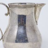 A small silver baluster cream jug, by Rodney C Pettit, hallmarks London 1972, height 10cm, 5.6oz