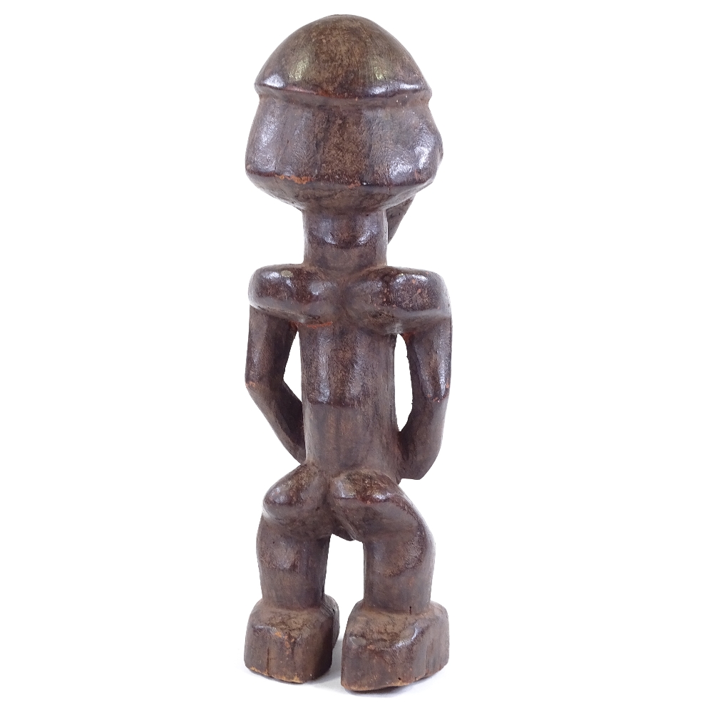 A Baule carved and stained wood Ancestor figure, height 34cm - Image 3 of 3