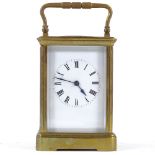 A French brass-cased carriage clock with striking movement, case height 13cm
