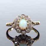 An unmarked gold cabochon opal and diamond cluster ring, setting height 11.3mm, size O, 3.3g