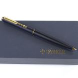 A Parker ballpoint pen, matte black/gold, new and boxed