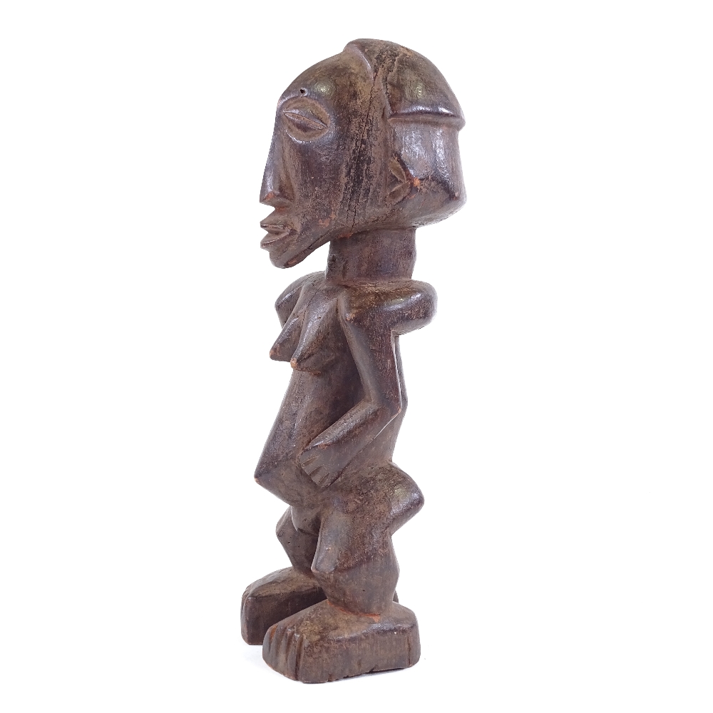A Baule carved and stained wood Ancestor figure, height 34cm - Image 2 of 3