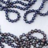 2 long strands of cultured black pearls, 256cm and 120cm (2)