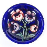 A Moorcroft Pottery tulip-design dish, 19cm across