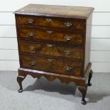 A Georgian style walnut chest on stand with crossbanded decoration, shaped apron and cabriole