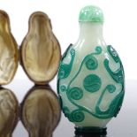 An Antique Chinese 2-colour overlay cameo glass snuff bottle, decorated with beasts, with jade-