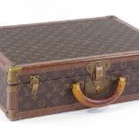 A Vintage Louis Vuitton monogram suitcase, with brass fittings and original leather handle, 50cm x