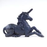 A Victorian cast-iron unicorn design fire ornament, length 57cm