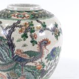 A Chinese porcelain jar with hand painted exotic bird, height 25cm