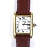 CARTIER - a lady's gold plated Tank quartz wristwatch, white dial with Roman numeral hour markers,