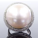 An 18ct white gold Mikimoto mabe pearl panel ring, with rope twist surround and pierced under