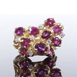 A 14ct gold ruby and CZ cluster abstract cocktail ring, with stylised openwork settings, setting