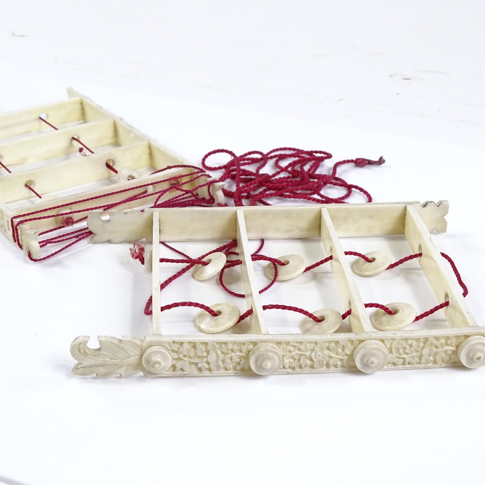 2 Chinese ivory puzzles with relief-carved sides, length 15cm