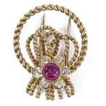 CARTIER - a 9ct gold cabochon ruby and diamond cluster rope twist knot dress clip/brooch, signed